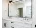 Bathroom featuring double sinks with marble countertops, a large mirror, and modern lighting fixtures at 754 Wriston Pl, Charlotte, NC 28209