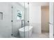 Modern bathroom with a frameless glass shower, a soaking tub, and sleek fixtures at 754 Wriston Pl, Charlotte, NC 28209