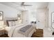 Bright bedroom featuring a ceiling fan, hardwood floors, and ample natural light from the window seat at 754 Wriston Pl, Charlotte, NC 28209
