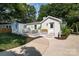 Charming white brick home with a cozy front porch and well-manicured landscaping at 754 Wriston Pl, Charlotte, NC 28209