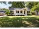 Well-manicured front yard of a white brick house with a covered porch at 754 Wriston Pl, Charlotte, NC 28209