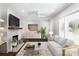 Bright living room with fireplace, modern decor, and ample natural light at 754 Wriston Pl, Charlotte, NC 28209