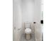 Small powder room with a white toilet, neutral paint and flooring, and minimalist fixtures at 754 Wriston Pl, Charlotte, NC 28209