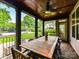 This covered patio features a wood ceiling with a fan and recessed lighting, and ample space for dining and entertaining at 7809 Greenfield Dr, Charlotte, NC 28270