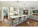 Bright kitchen with quartz countertops, stainless steel appliances, and a stylish island with seating at 7809 Greenfield Dr, Charlotte, NC 28270
