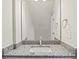 Bathroom with granite countertops, single sink, and large mirror at 808 Carolyn Ave, Kannapolis, NC 28083