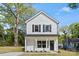 Charming two-story home with white siding, black shutters, and a welcoming front porch at 808 Carolyn Ave, Kannapolis, NC 28083