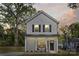 Charming two-story home with gray siding, black shutters, and a welcoming front porch at 808 Carolyn Ave, Kannapolis, NC 28083