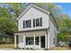 Charming two-story home with white siding, black shutters, and a welcoming front porch at 808 Carolyn Ave, Kannapolis, NC 28083