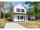 Charming two-story home with white siding, black shutters, and a welcoming front porch at 808 Carolyn Ave, Kannapolis, NC 28083