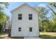 Back of the home featuring white siding, windows and a door at 808 Carolyn Ave, Kannapolis, NC 28083