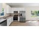 Modern kitchen with stainless steel appliances, granite countertops, and white cabinets at 808 Carolyn Ave, Kannapolis, NC 28083