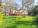 The backyard features a spacious wooden deck, perfect for outdoor entertaining at 8801 Chinaberry Ln, Concord, NC 28027