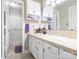Bathroom featuring white cabinets, white tile countertops, and walk-in shower with purple decor at 8801 Chinaberry Ln, Concord, NC 28027