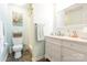 Bathroom featuring a white vanity, a toilet, and a shower with light blue colored walls at 8801 Chinaberry Ln, Concord, NC 28027