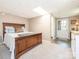Bedroom featuring a wood bed frame, neutral carpet, and access to a bathroom and back door at 8801 Chinaberry Ln, Concord, NC 28027