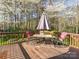 Relaxing wooden deck with outdoor furniture, perfect for enjoying nature at 8801 Chinaberry Ln, Concord, NC 28027