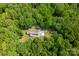 Stunning aerial view of a secluded home surrounded by lush greenery and mature trees at 9941 Heritage Oak Ln, Waxhaw, NC 28173