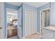 View of a bright, updated bathroom, with access to the bedroom and a tiled shower at 9941 Heritage Oak Ln, Waxhaw, NC 28173