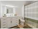 Bright bathroom featuring a vanity with storage and a shower with a modern curtain at 9941 Heritage Oak Ln, Waxhaw, NC 28173