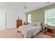 Standard-sized bedroom with a window, carpet, and ceiling fan at 9941 Heritage Oak Ln, Waxhaw, NC 28173