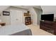 Bedroom with neutral carpet, standard closet, TV, and dresser at 9941 Heritage Oak Ln, Waxhaw, NC 28173