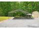 View of carport with gravel bed, storage shed, and boat at 9941 Heritage Oak Ln, Waxhaw, NC 28173