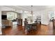 Open dining area with built-in features, seamlessly connected to the living room at 9941 Heritage Oak Ln, Waxhaw, NC 28173