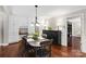 Cozy dining area with built-in cabinets and a view into other living spaces at 9941 Heritage Oak Ln, Waxhaw, NC 28173