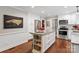 Kitchen boasts a large center island with granite countertops and stainless steel appliances at 9941 Heritage Oak Ln, Waxhaw, NC 28173