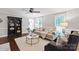 Bright living room featuring hardwood floors, natural light, and stylish furnishings at 9941 Heritage Oak Ln, Waxhaw, NC 28173