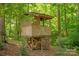 Elevated wooden structure in a wooded setting, with storage underneath at 9941 Heritage Oak Ln, Waxhaw, NC 28173