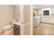 Bathroom and partial kitchen view featuring cabinetry, countertop and sink at 1000 Rudd Rd, Gastonia, NC 28054