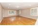 Bright bedroom with hardwood floors, neutral walls, and windows with traditional shutters at 1000 Rudd Rd, Gastonia, NC 28054