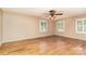 Spacious bedroom with hardwood floors, neutral walls, and bright natural light from the windows at 1000 Rudd Rd, Gastonia, NC 28054