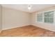 Bedroom filled with hardwood flooring and natural light; featuring neutral walls and window at 1000 Rudd Rd, Gastonia, NC 28054