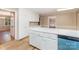 Bright kitchen featuring white cabinetry and a central island with stainless steel appliances at 1000 Rudd Rd, Gastonia, NC 28054