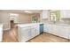 Open kitchen with white cabinets, quartz countertops, and stainless steel appliances at 1000 Rudd Rd, Gastonia, NC 28054