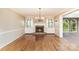 Formal living room featuring a fireplace, hardwood floors, and built-in cabinets at 1000 Rudd Rd, Gastonia, NC 28054