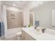 Well-lit bathroom with a combination tub and shower, and a wide vanity at 10528 Audubon Ridge Dr, Cornelius, NC 28031