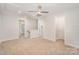 Spacious bonus room with neutral walls, carpet flooring, and a ceiling fan at 10528 Audubon Ridge Dr, Cornelius, NC 28031