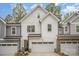 Charming new construction home features a two-car garage, light gray exterior, and well-maintained landscaping at 10528 Audubon Ridge Dr, Cornelius, NC 28031