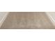 Close-up of neutral carpet flooring with white baseboards at 10528 Audubon Ridge Dr, Cornelius, NC 28031