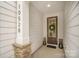 Inviting entryway with stone accents, a stylish front door with a wreath, and a covered porch at 10528 Audubon Ridge Dr, Cornelius, NC 28031