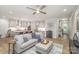 Open living space with hardwood floors, stylish furniture, and a view into the modern kitchen at 10528 Audubon Ridge Dr, Cornelius, NC 28031