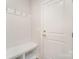 Well-organized mud room with a built-in bench, hooks, and storage shelves at 10528 Audubon Ridge Dr, Cornelius, NC 28031