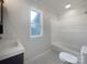 Bathroom featuring a white vanity, toilet, and a bathtub with shower at 109 Downing St, Troutman, NC 28166