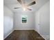 Cozy bedroom with wood-look floors and a ceiling fan for added comfort at 109 Downing St, Troutman, NC 28166