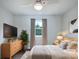 Comfortable bedroom is virtually staged with neutral decor and includes a ceiling fan at 109 Downing St, Troutman, NC 28166