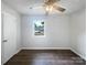 Bedroom showcasing a ceiling fan and a window with neighborhood views at 109 Downing St, Troutman, NC 28166